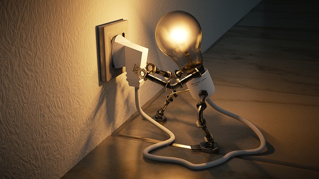 A lightbulb plugs itself into the wall socket.