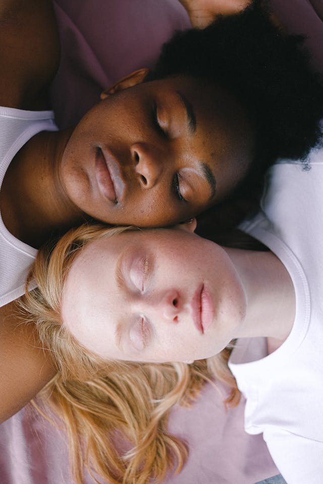 Two women's faces - one black - one white