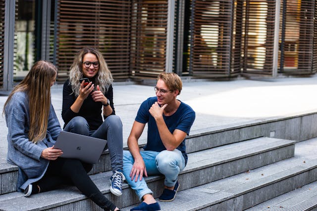 A group of researchers outside a university