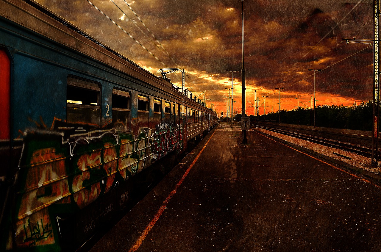 A train moves away in a grim, dark-orange polluted landscape