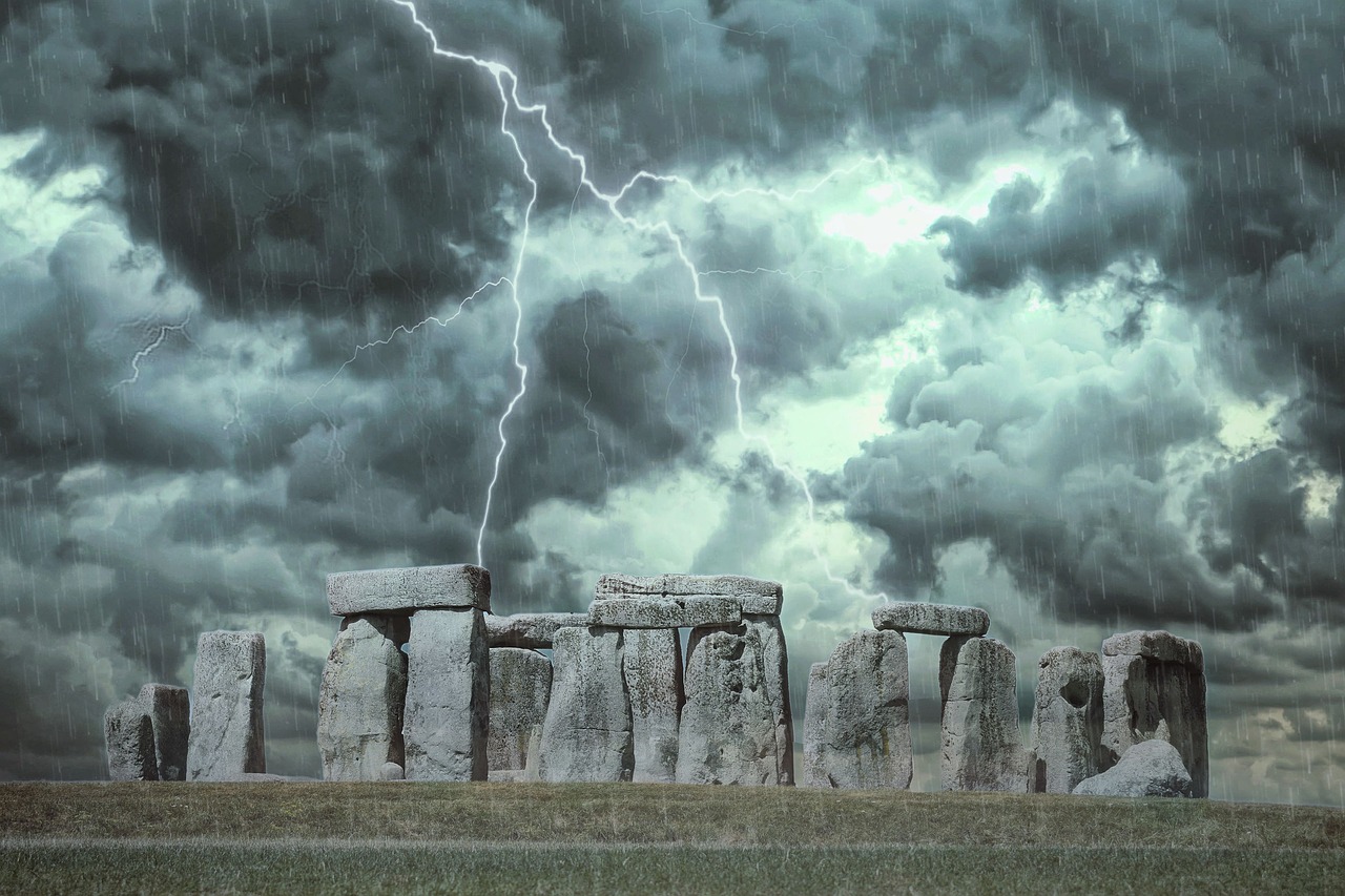 Stonehenge megaliths against a stormy background