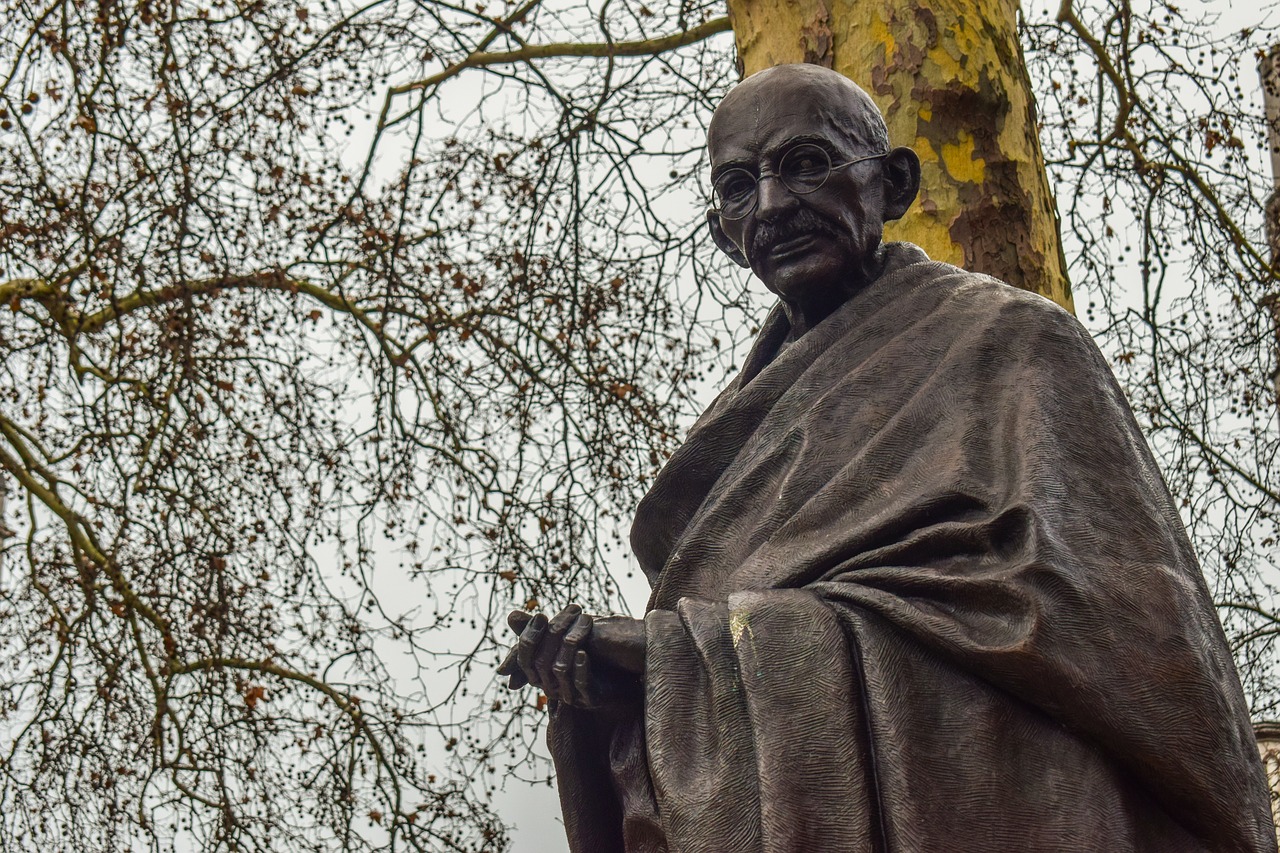 Statue of Mahatma Gandhi, with a tree behind it