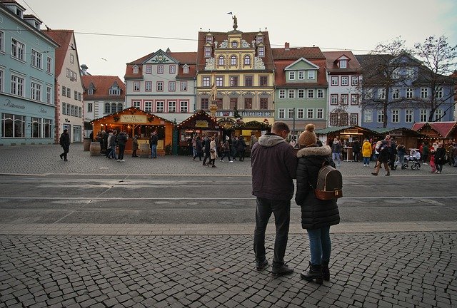 A couple look over a medieval city centre
